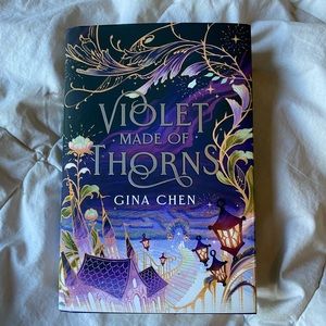 Owlcrate version of Violet Made of Thorns by Gina Chen